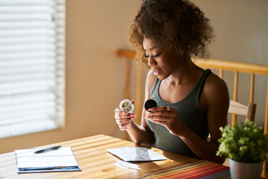 Woman reading instructions on microdosing cannabis